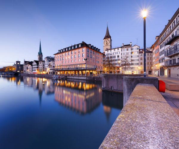 Zurich, Switzerland on the Limmat River at blue hour.